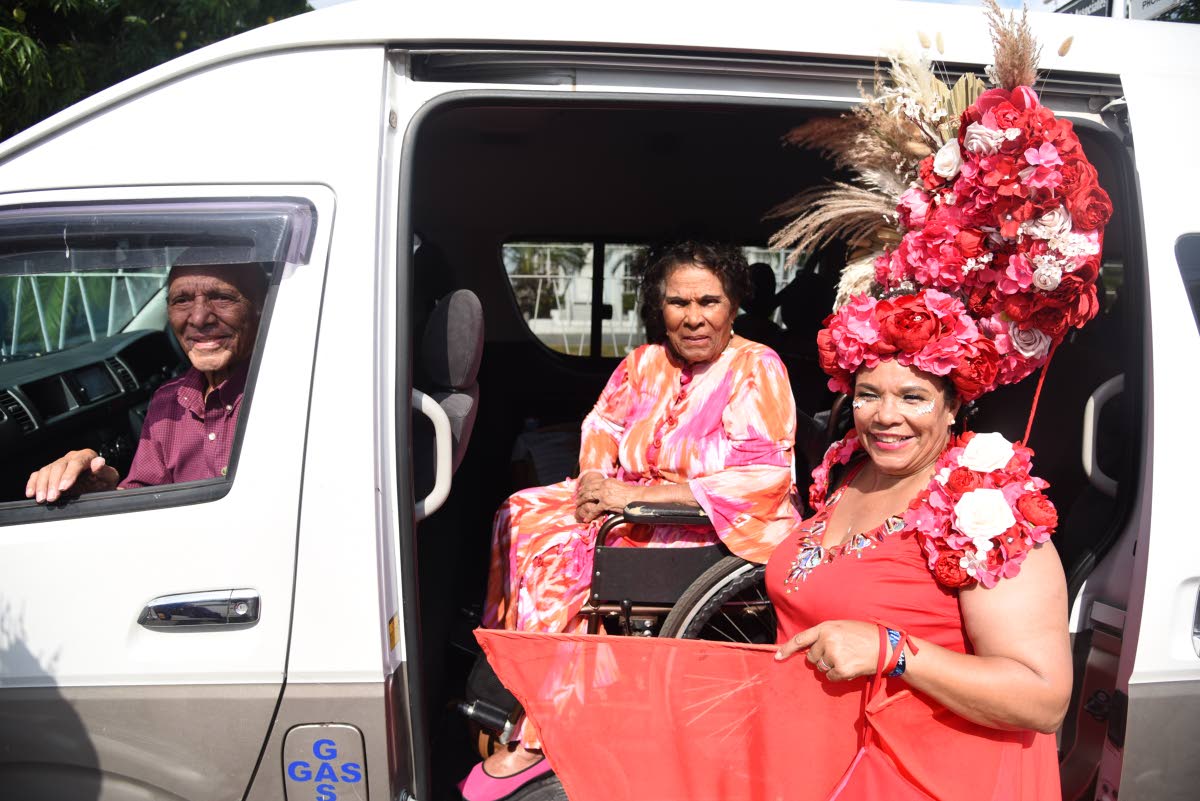 Ishmael Robertson (left) with his wife Hermenia Robertson (centre) and  fêting daughter Corah Ann Robertson-Sylvester. 