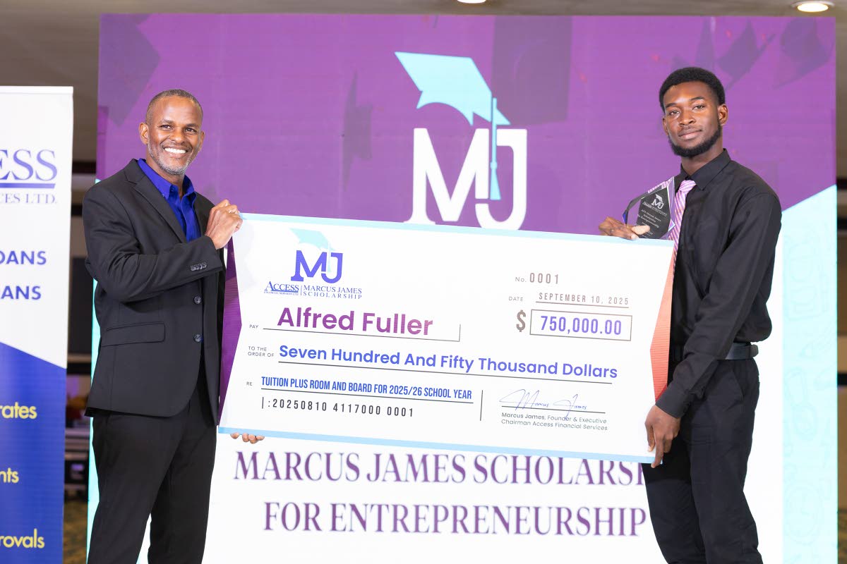 Access Financial Services Founder and Executive Director Marcus James (left) presents the inaugural AFS Marcus James Scholarship for Entrepreneurship cheque to recipient Alfred Fuller, a first-year University of Technology, Jamaica, student, who is pursuin