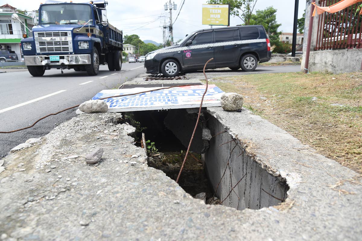 Open drains in the sidewalk along the Paul Bogle Highway in Morant Bay, St Thomas.