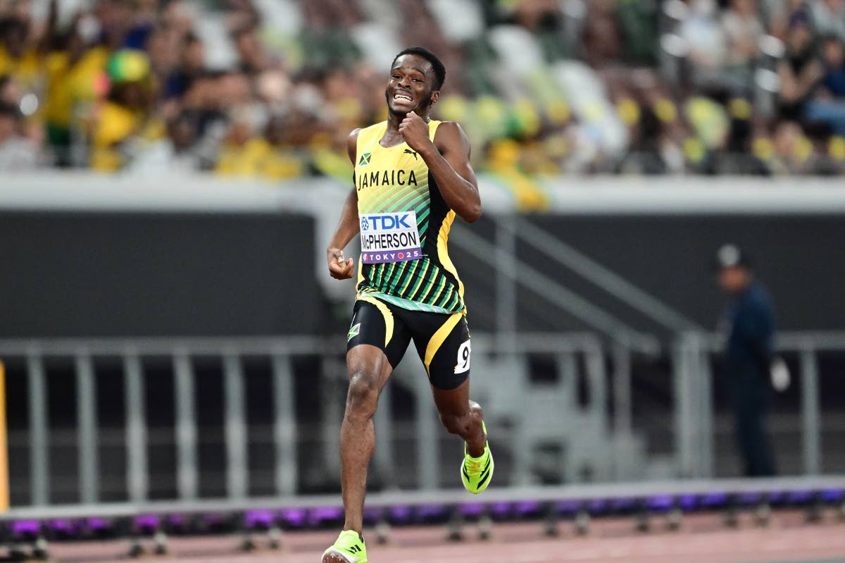 Bovel McPherson powering home in his 400m heat on day of the World Athletics Championships in Tokyo, Japan yesterday. McPherson placed third in a personal best 44.51 seconds and advanced to the semi-finals. 