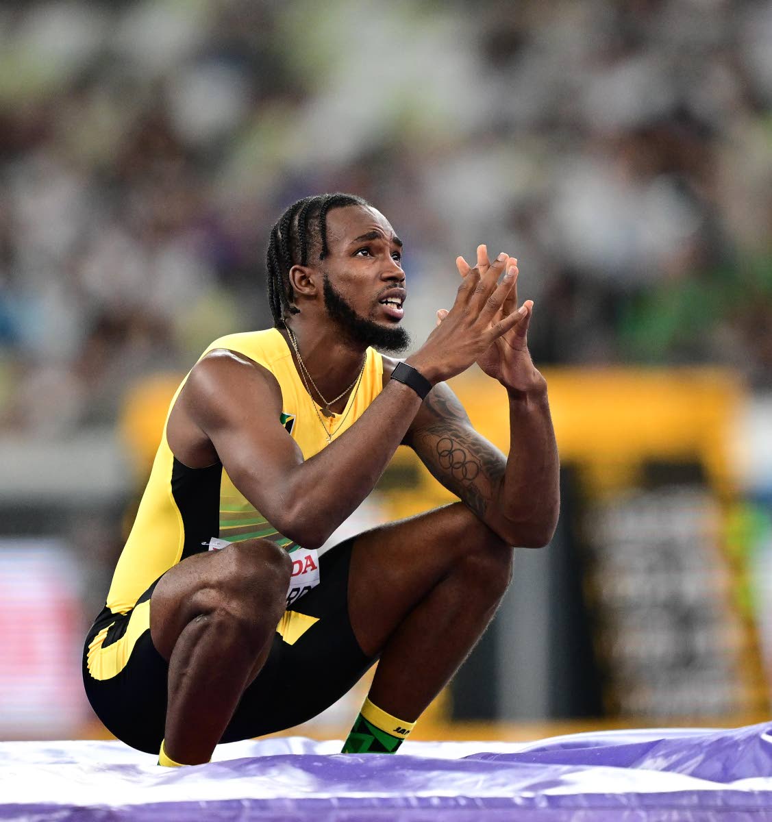 Romaine Beckford reacts after failing to make a height in the men’s long jump final at the World Athletics Championships inside the Japan National Stadium in Tokyo yesterday.