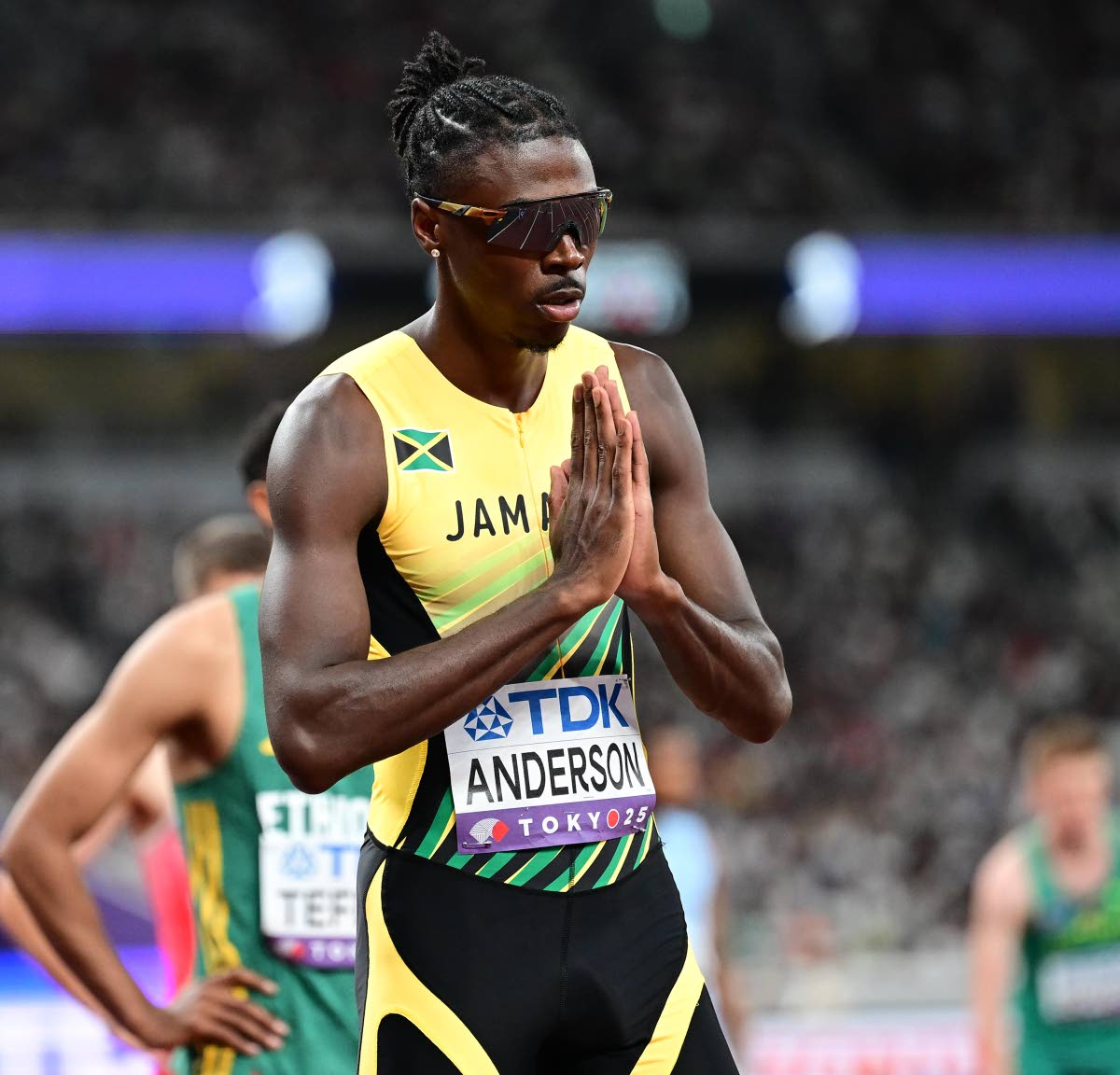 Navasky Anderson makes his trademark signal ahead of the start of his 800-metre heat at the World Athletics Championships inside the Japan National Stadium in Tokyo yesterday.