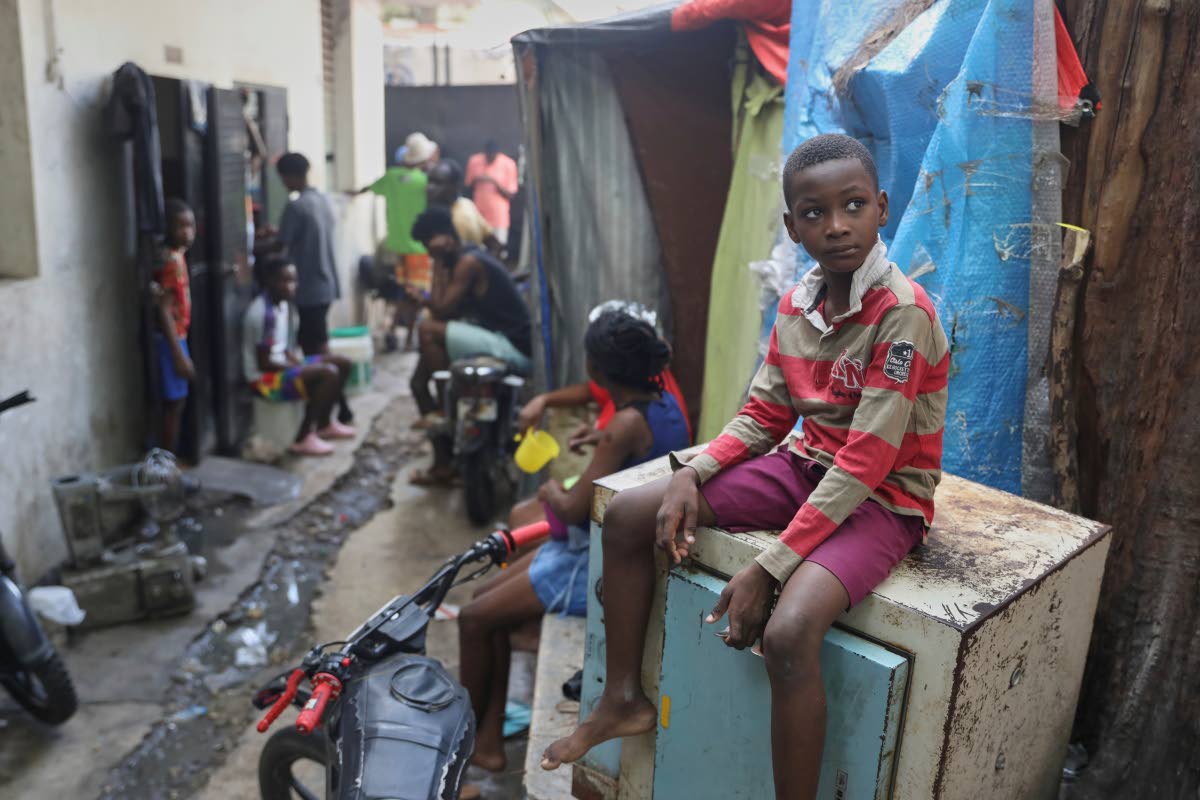 People displaced by gang violence live at the Ministry of Public Works, Transport and Communications office converted into a shelter in Port-au-Prince, Haiti.