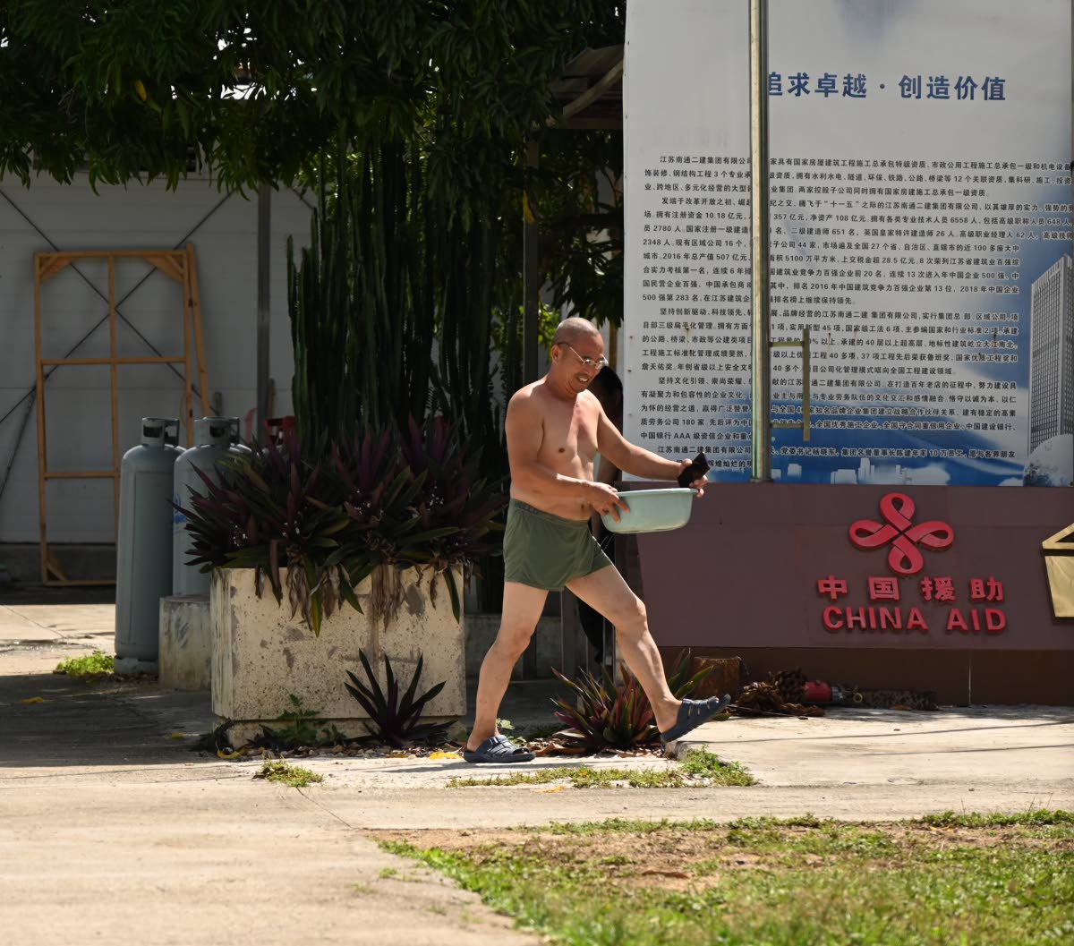One of several Chinese workers employed for the construction of the Western Child and Adolescent Hospital in Mt Salem, St James, carrying out domestic duties at the workers’ quarters after they took strike action on Wednesday, September 17 to protest the