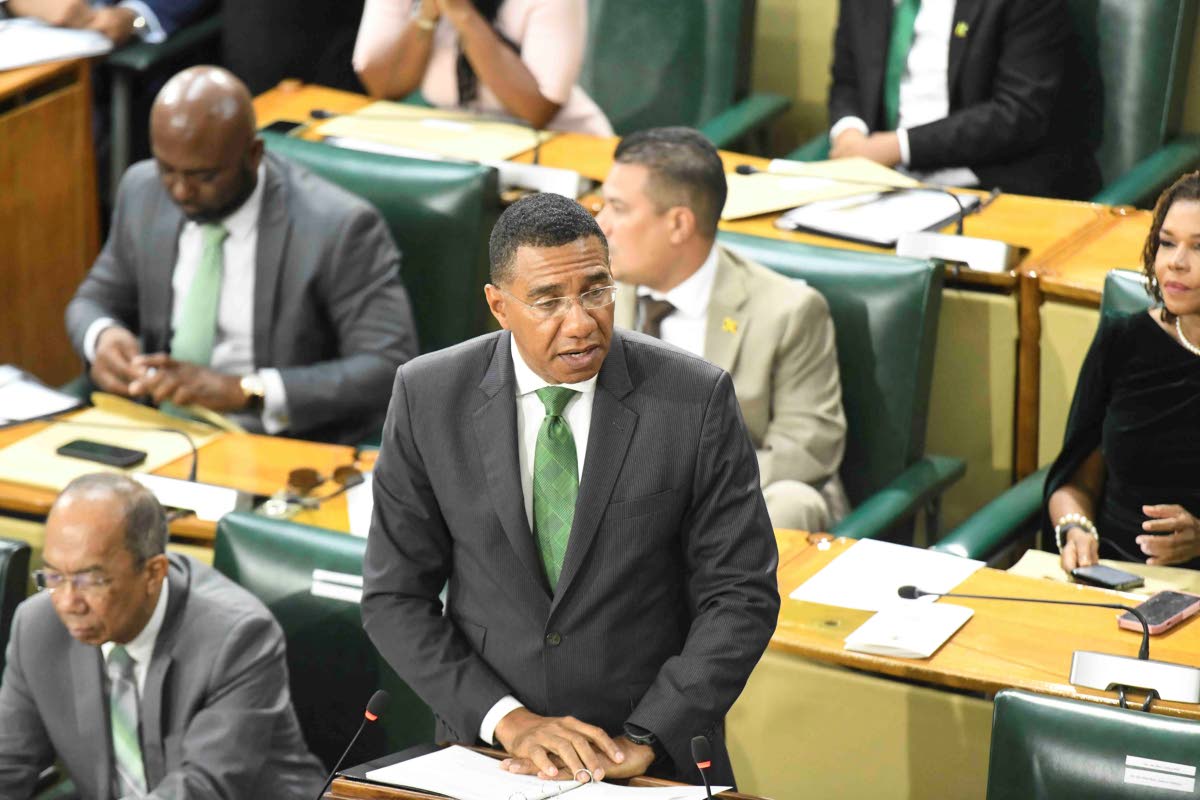 Prime Minister Dr Andrew Holness, and members of parliament of the ruling party at the swearing-in ceremony at Gordon House. 