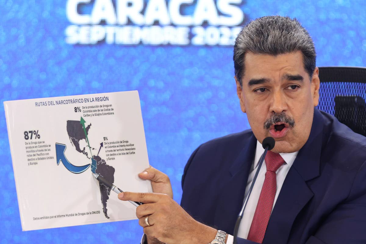 Venezuelan President Nicolás Maduro points at a map of the Americas during a press conference in Caracas.