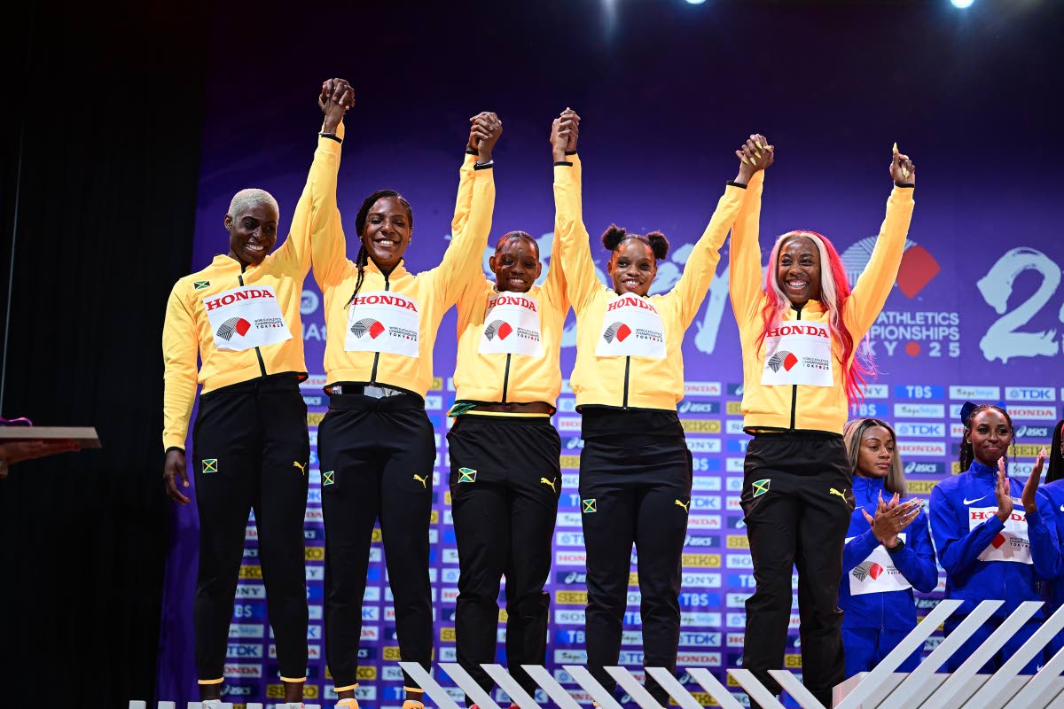 Jamaica’s 4x100m relay members (from left) Jodean Williams (who ran in the heats), Jonielle Smith, Tina Clayton, Tia Clayton and Shelly-Ann Fraser Pryce on the podium to receive their silver medals.