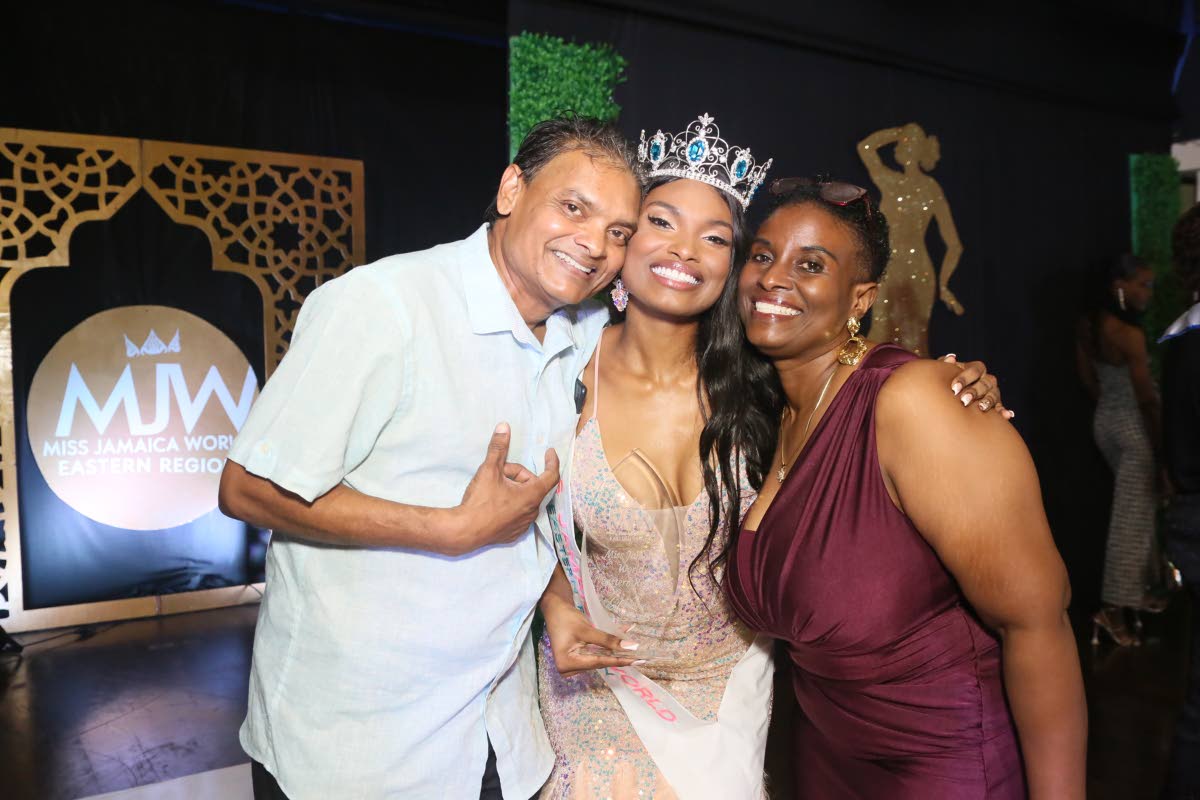 Proud parents Terry Roman (left) and Simone Ormsby hug their daughter, Kalea Roman (centre), the newly crowned Miss Jamaica World Eastern.