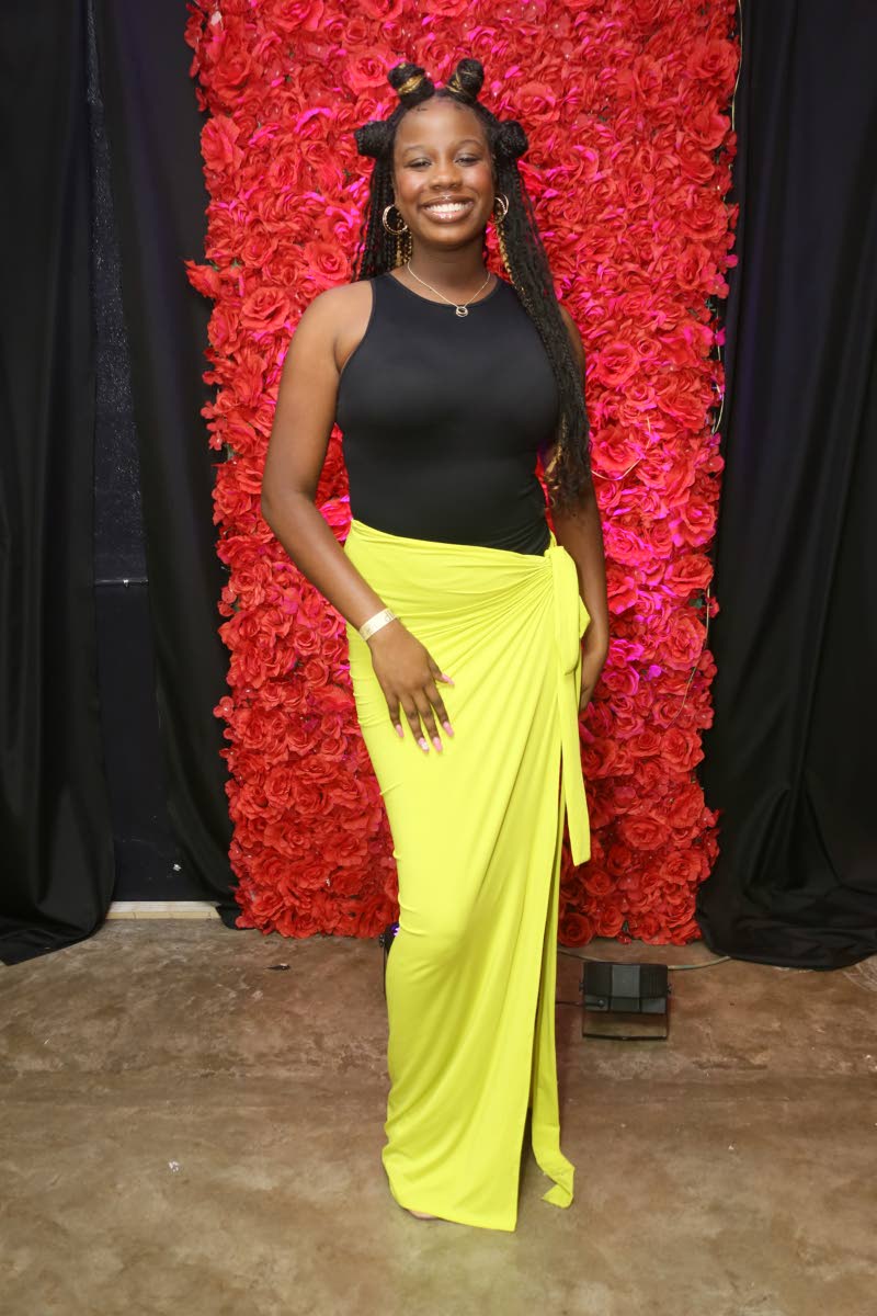 Pageant enthusiast Kelsie Spaulding is spotted at the Miss Jamaica World Eastern Region grand coronation in a Zara bodysuit and sunshine yellow Shein skirt.