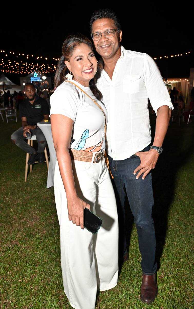 Richard Pandohie, CEO and managing director of Seprod, draws close to his wife Nicole, director of the Jamaica Food and Drink Kitchen, for a quick photo.