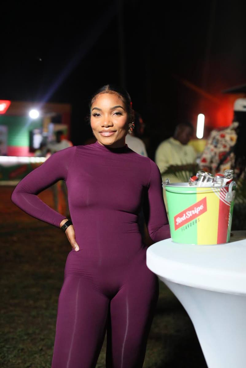 Taura Cammock, chief executive officer of Eyes by Taura, is plum perfection in a curve-hugging bodysuit.