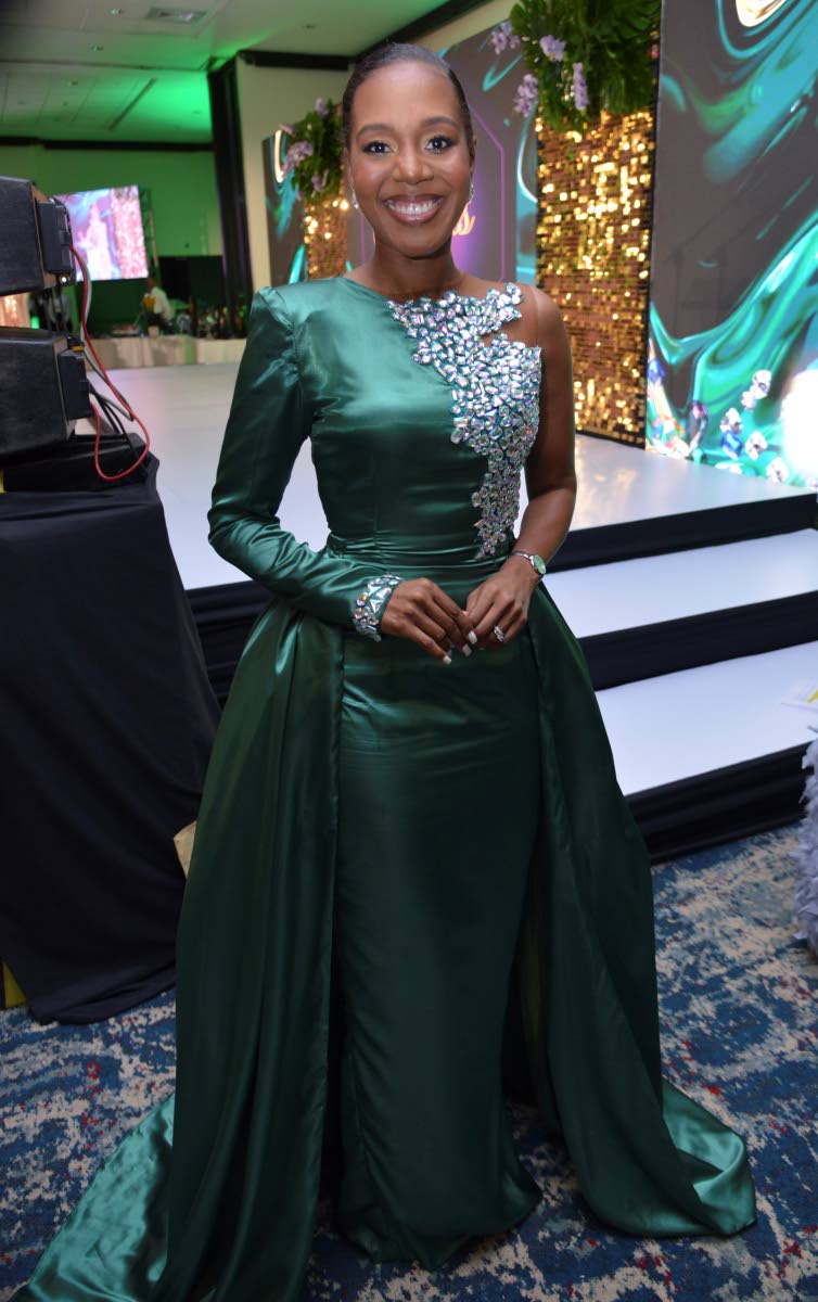 M&E Awards Gala host Dr Terri-Karelle Johnson wears a green Sophia Jones Designs illusion gown.