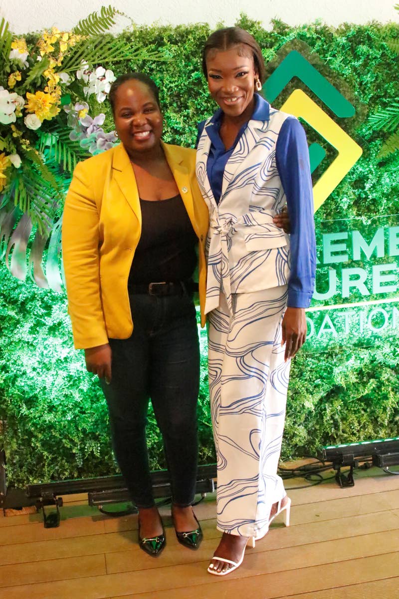 Tishauna Mullings (right) is joined by Chloleen Daley-Muschett, assistant vice-president of public relations and corporate affairs, for a quick photo during the Supreme Ventures Foundation Supreme Community Hero Programme finale.