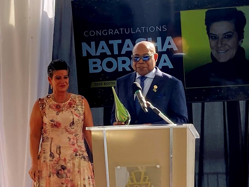 Minister of Tourism Edmund Bartlett and Natasha Borota, grand prize winner of the Edith Baxter Memorial Award, at Palais Royale in Toronto.