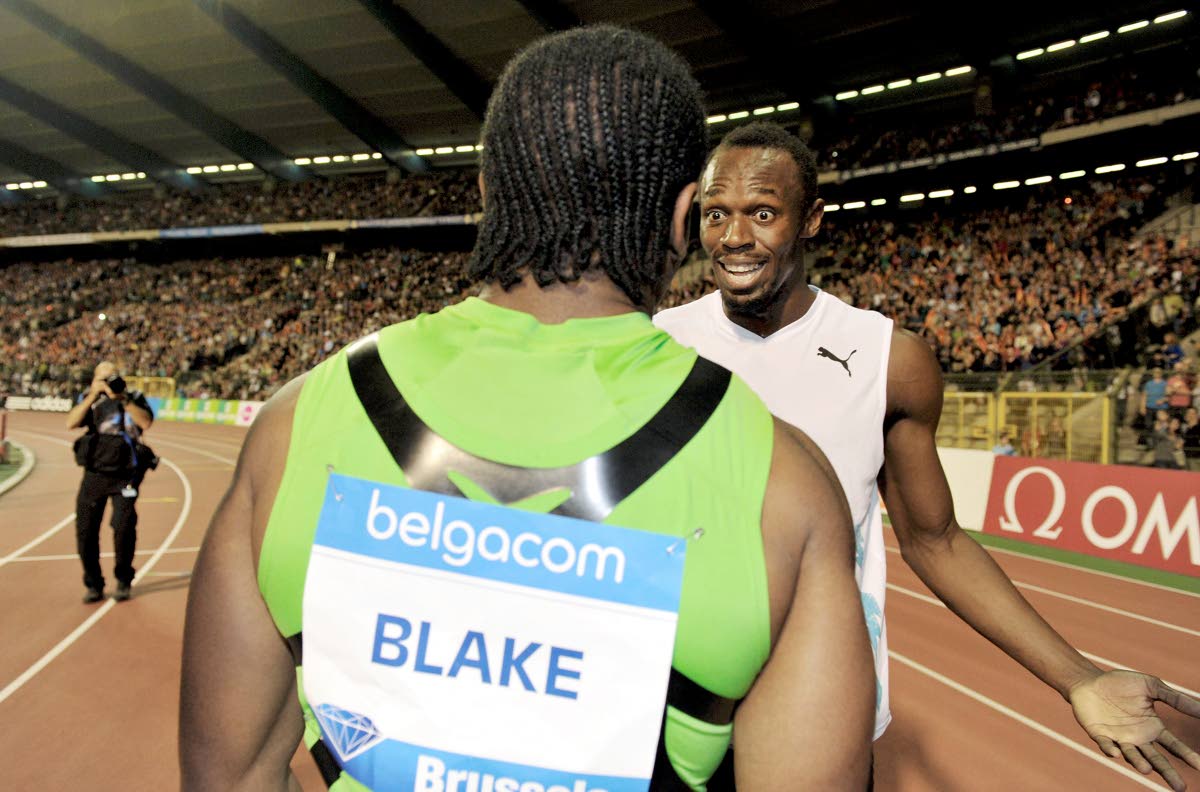 
Yohan Blake (foreground) and Usain Bolt, both from Jamaica, react after Blake’s stunning clocking during the men’s 200 metres event during the Memorial Van Damme Diamond League meeting in Brussels on Seprtember 16, 2011. Blake won the event in 19.26 s