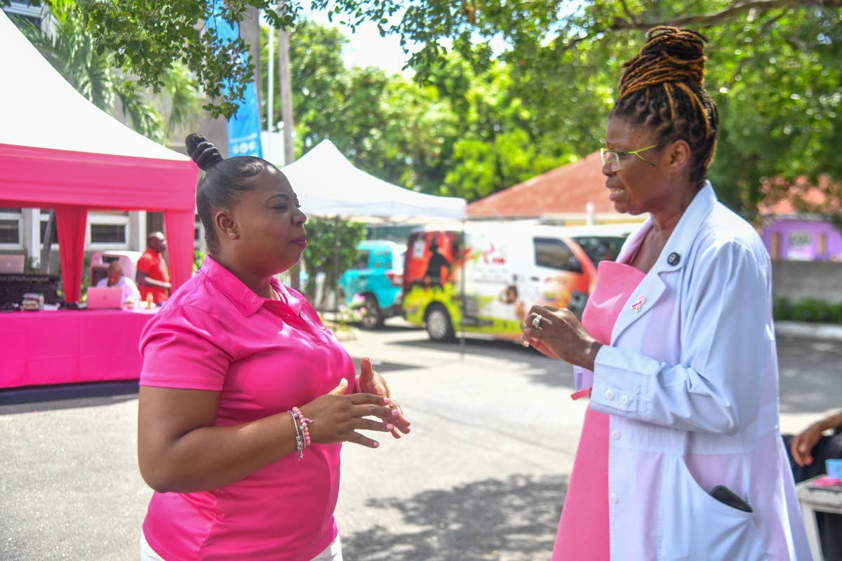 
Roshane Reid-Koomson (left), executive director of the Jamaica Cancer Society, and Dr Derria Cornwall-Bernard, consultant radiologist at The University Hospital of the West Indies, in conversation at the World Mammography Day celebration on Friday.