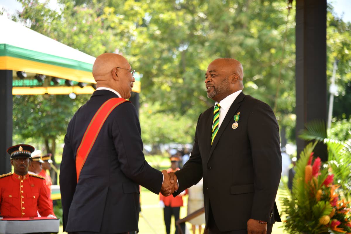 Lloyd Carney, chancellor of the University of Technology and recipient of membership in the Order of Distinction in the rank of Commander, with Governor General Sir Patrick Allen during the Ceremony of Investiture and Presentation of National Honours and A