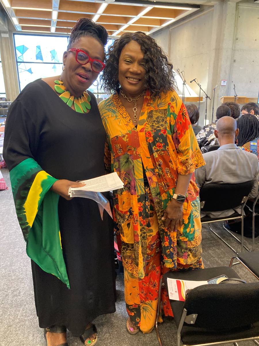 Joan Andrea Hutchinson and Marcia Brown share a photo at an exhibit titled 'Heritage Singers Canada: A Legacy of Caribbean Folk Music, Culture, and Community' which ran from September 15 to October 16.