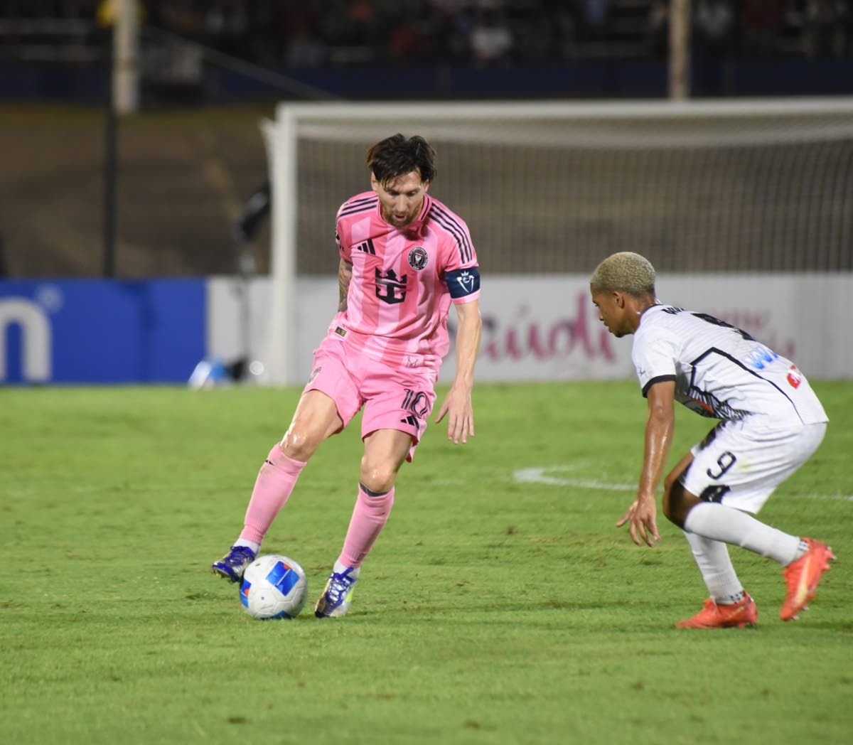 Inter Miami’s Lionel Messi tries to go around Cavalier’s Kaile Auvray during their Concacaf Champions Cup round-of-16 second-leg match at the National Stadium on March 13, 2025.