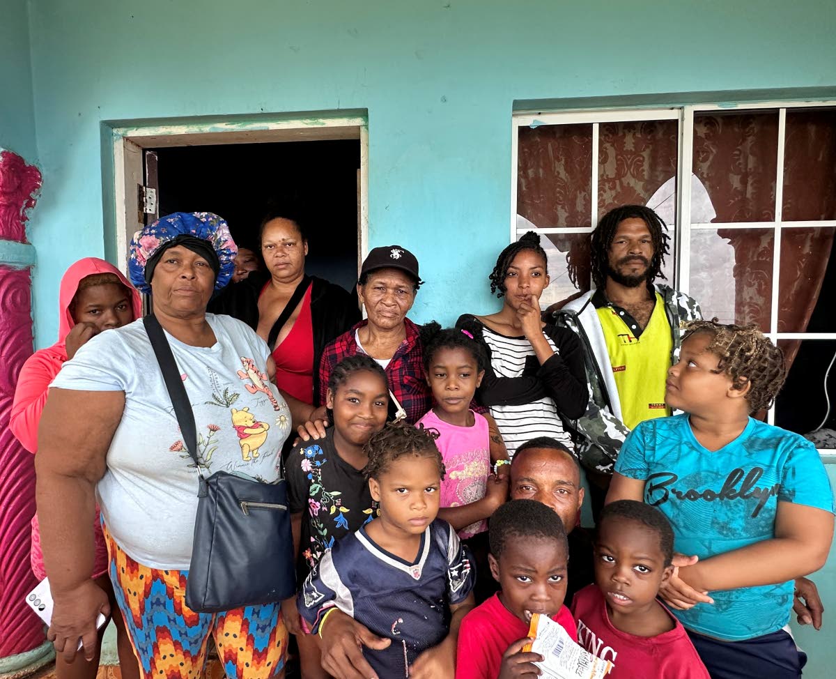 Rosemarie Bent in a photo with persons using her home in Flagaman, St Elizebeth, as a shelter. Those persons had nowhere to go as they prepared for the Category 5 Hurricane Melissa which is expected to make landfall today. 