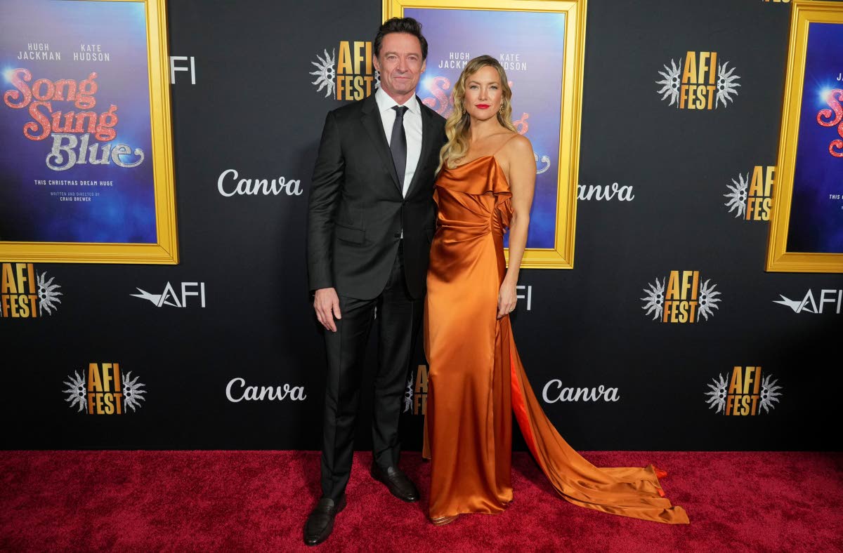 Co-stars of ‘Song Sung Blue’, Hugh Jackman and Kate Hudson, pose for the cameras at the AFI FEST premiere on Sunday.
