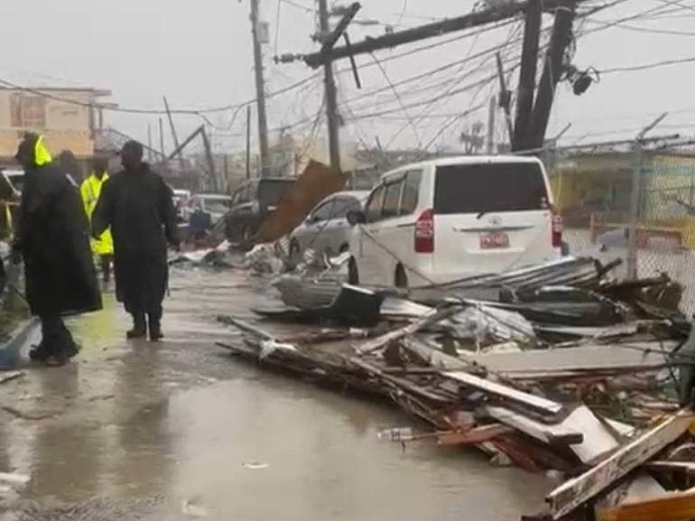 Police personnel at the Black River Police Station in St Elizabeth accessing damage to the station during the passage of Hurricane Melissa on October 28, 2025.