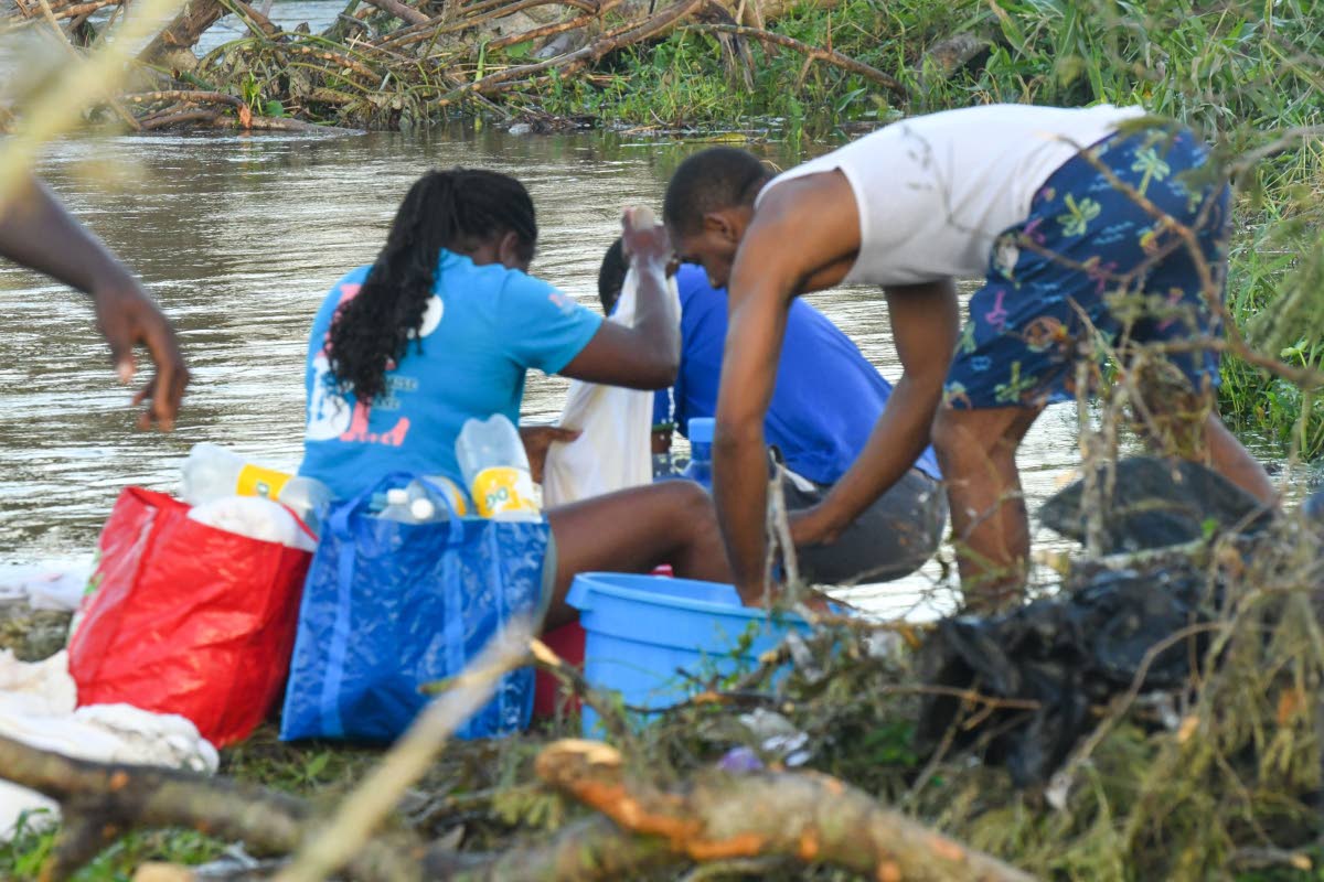 Residents of Westmoreland can be seen washing clothes at the river on October 31. 