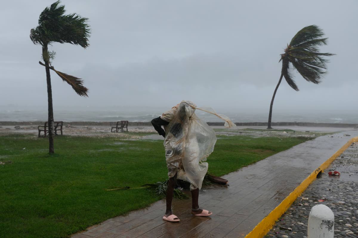 A man walks in Kingston, Jamaica, as Hurricane Melissa approached on Tuesday, October 28.
