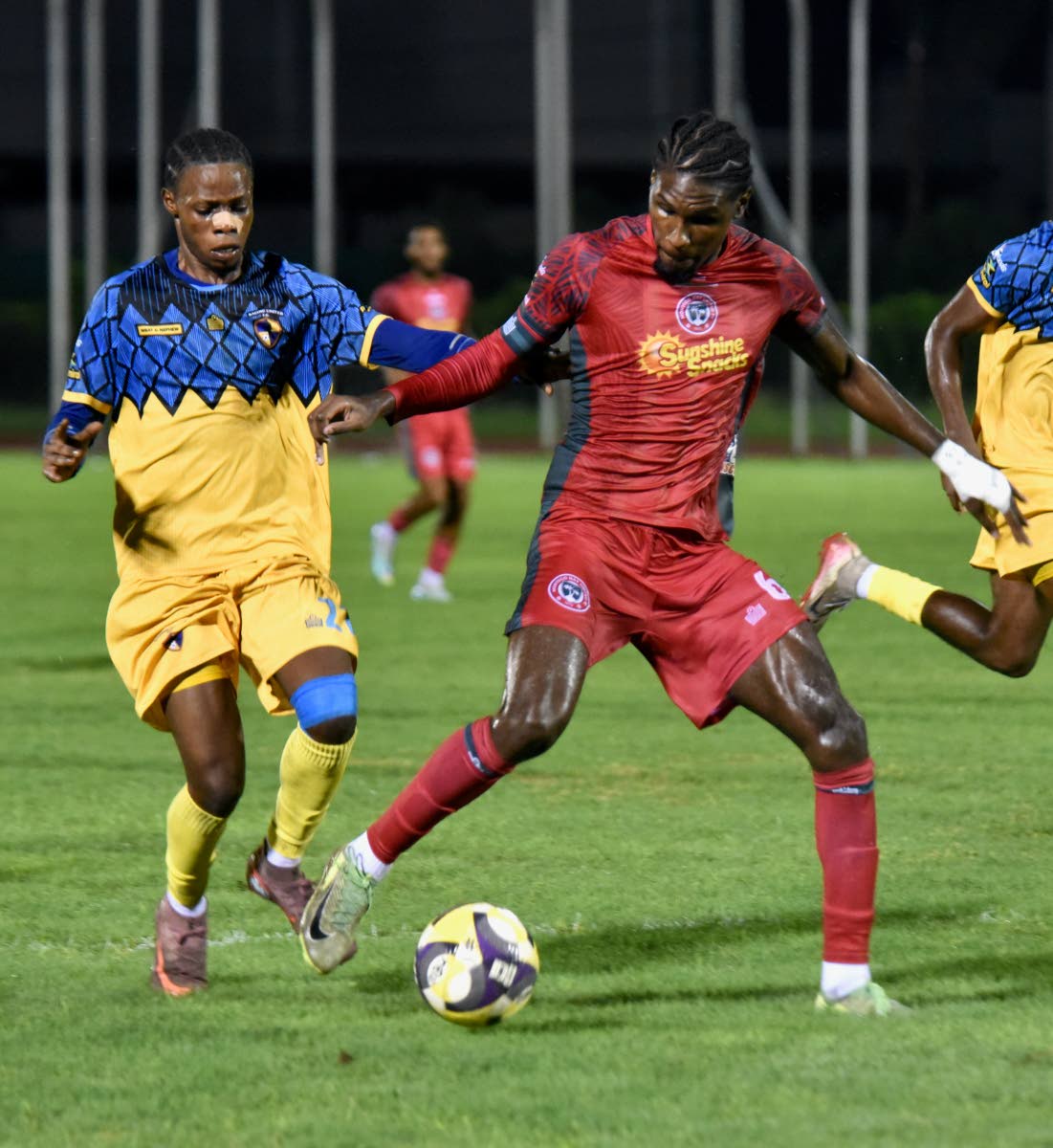 Montego Bay United’s Lucas Lima Correa (right) tries to dribble away from Racing United’s Tameish Richardson during their Jamaica Premier League (JPL) match at the Montego Bay Sports Complex in Montego Bay on Sunday, October 19.
