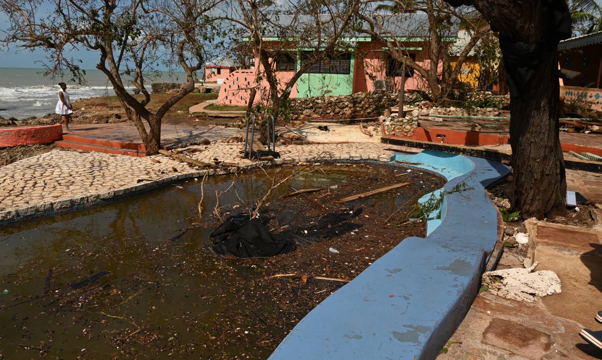 The aftermath of Hurricane Melissa leaves the pool at Jakes cluttered with debris and vegetation.