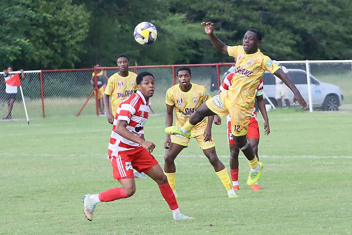 
Garvey Maceo High School’s Javan Foster (right) jumps to play the ball while Glenmuir High’s Dunsting Cohen reacts during their Zone I, ISSA WATA daCosta Cup football match at Glenmuir High School on Wednesday, October 8. Garvey Maceo High came from b
