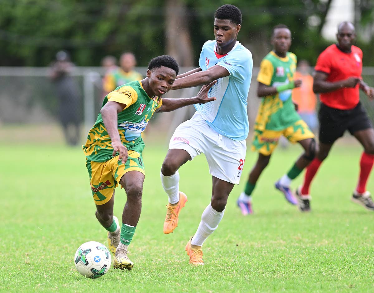 
Kimarly Scott of Excelsior High School (left) is challenged by Kevaughn Brown of St George’s College during their ISSA WATA Manning Cup football match at Winchester Park, St George’s College on Saturday, October 11.