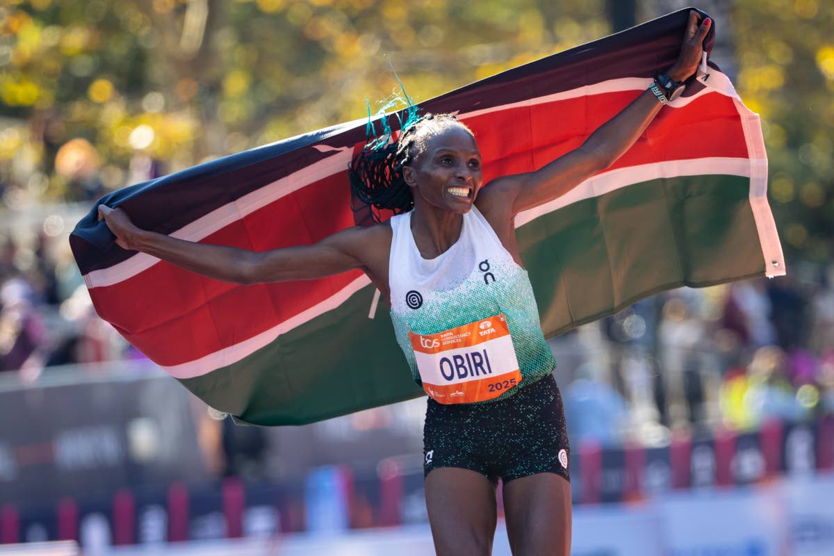 Hellen Obiri celebrates winning first place in the women’s elite division of the New York City Marathon yesterday in New York. 