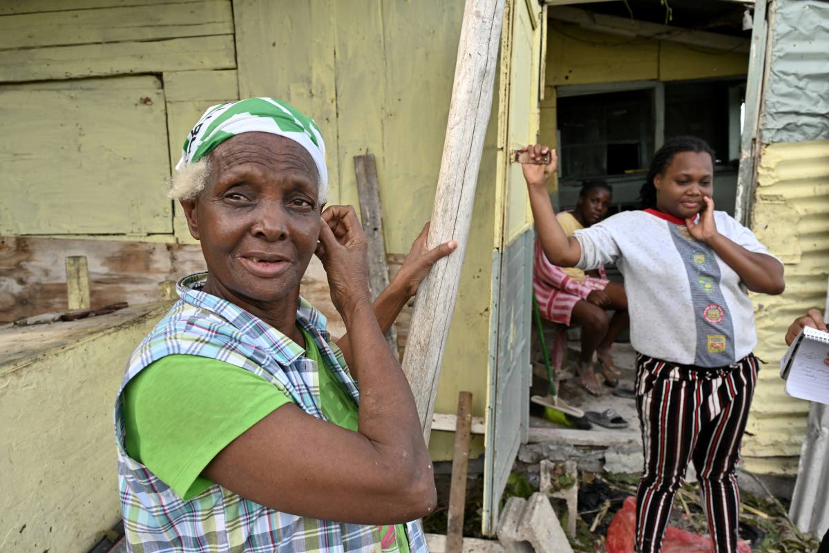 Cislyn Tulloch (left) and her daughter, Teneisha Kelly, recall the horrors of Hurricane Melissa in Windsor, St Ann