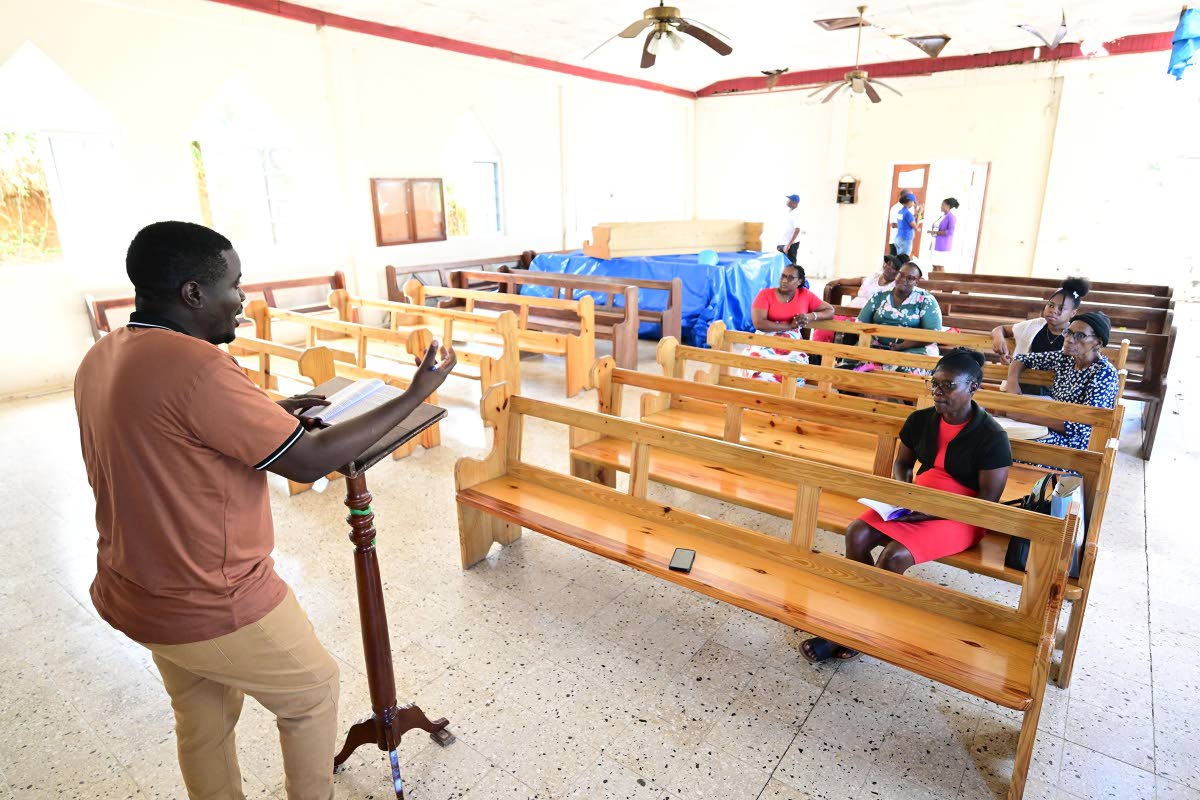 Credentialled Minister Abdel Campbell addresses the congregation on Sunday at the Greenland New Testament Church of God in Hanover.