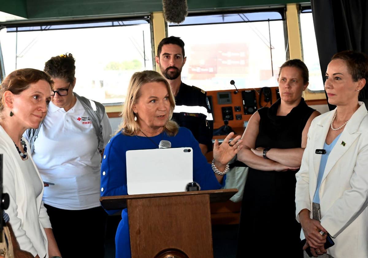 EU Ambassador Dr Erja Askola delivers remarks during Monday’s handing over of emergency supplies following Hurricane Melissa. Foreign Affairs Minister Kamina Johnson Smith (right) and European partners look on.