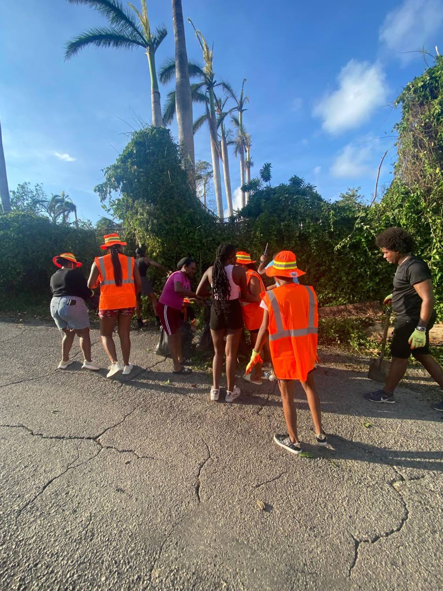 Employees of Hah-R-Mony Entertainment Limited assist with post-Hurricane Melissa cleanup efforts in Montego Bay, St James.