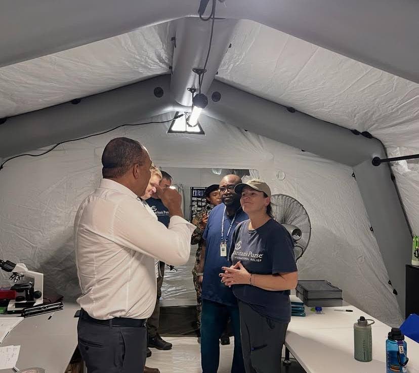 Minister of Health and Wellness, Dr Christopher Tufton, (left) with a team from international Christian relief organisation Samaritan’s Purse at the field hospital that was set-up by the organisation on the grounds of the Black River High School in St El