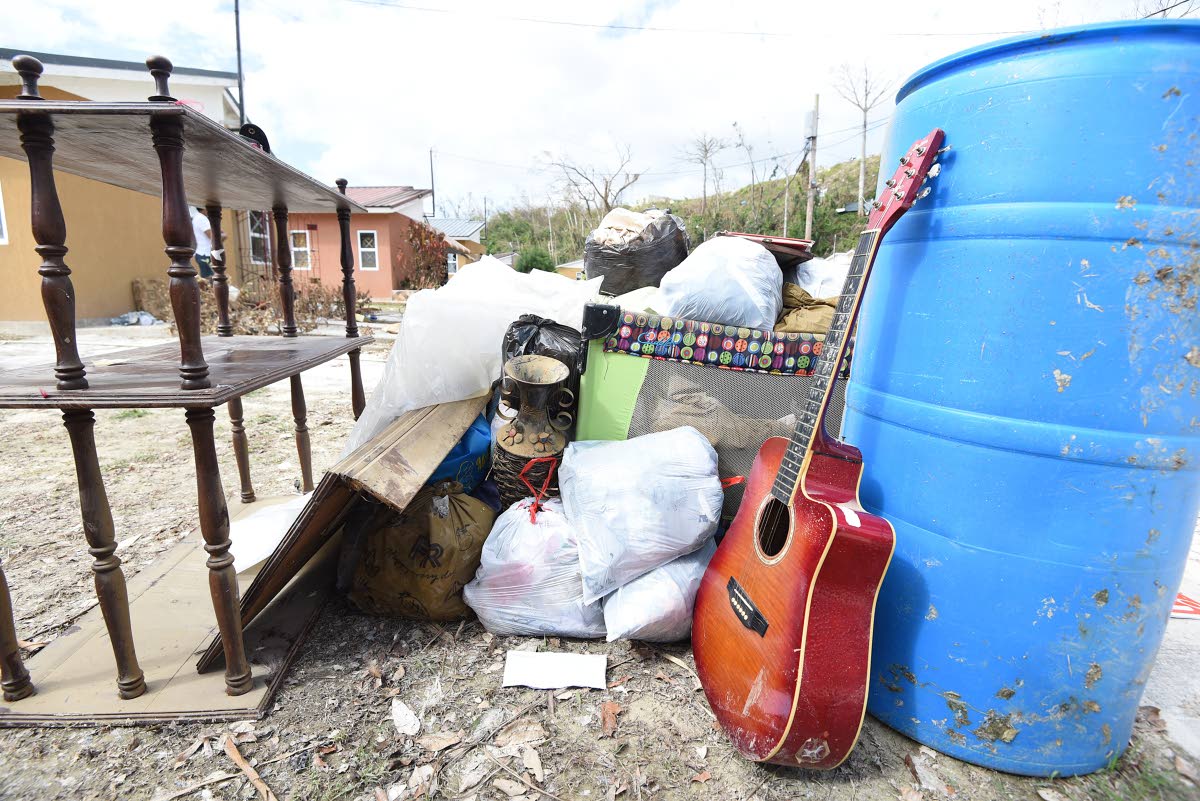 
Some possessions put out to dry after flooding at The Estuary in St James.