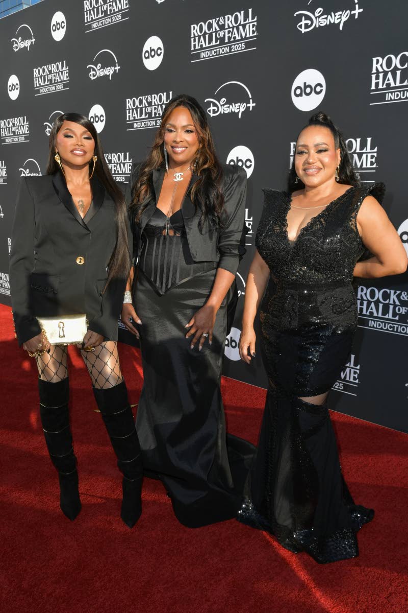 From left: Jamaican-American rapper Sandra Denton, DJ Spinderella and Cheryl James of Salt-N-Pepa in bold black ensembles — blending tailoring, satin and sequins for their Rock & Roll Hall of Fame moment.