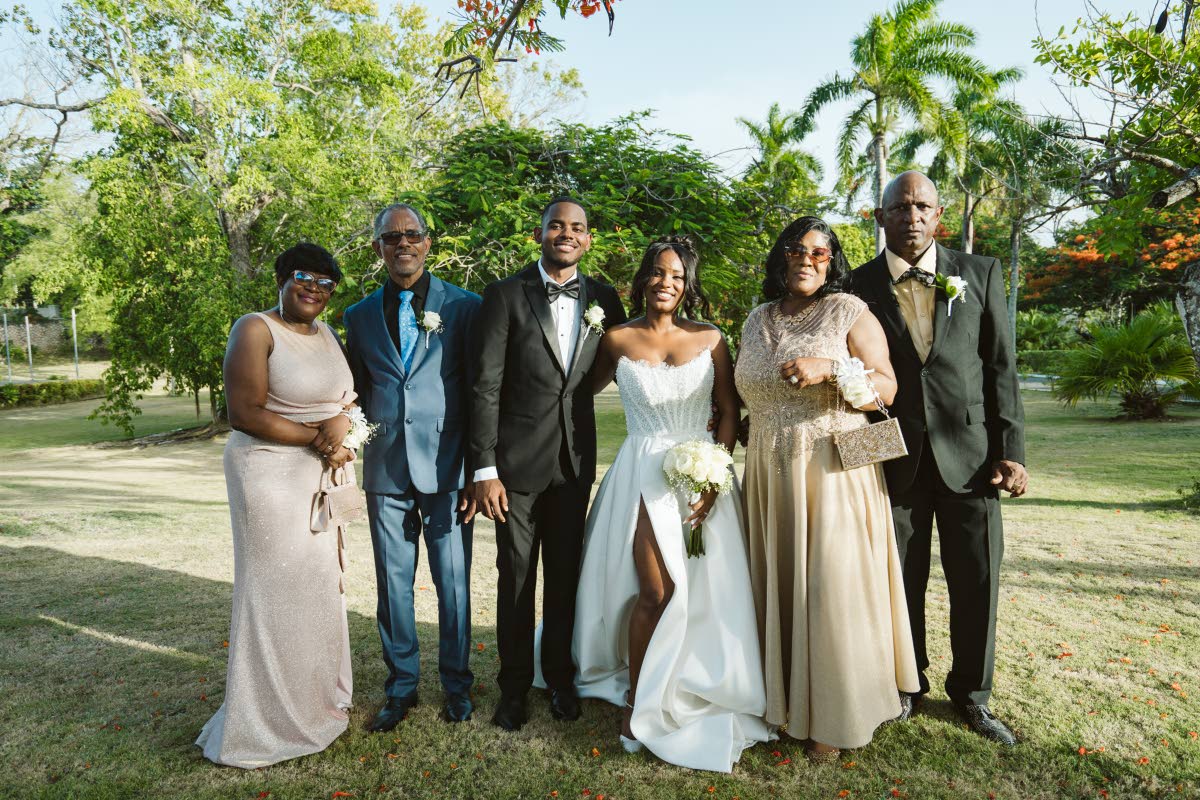 Celebrating the moment are (from left) the groom’s parents Michelle and Alphanso Harris; newly-weds Richard and Kamille; and the bride’s parents Rose Greaves and Alrick Griffiths.