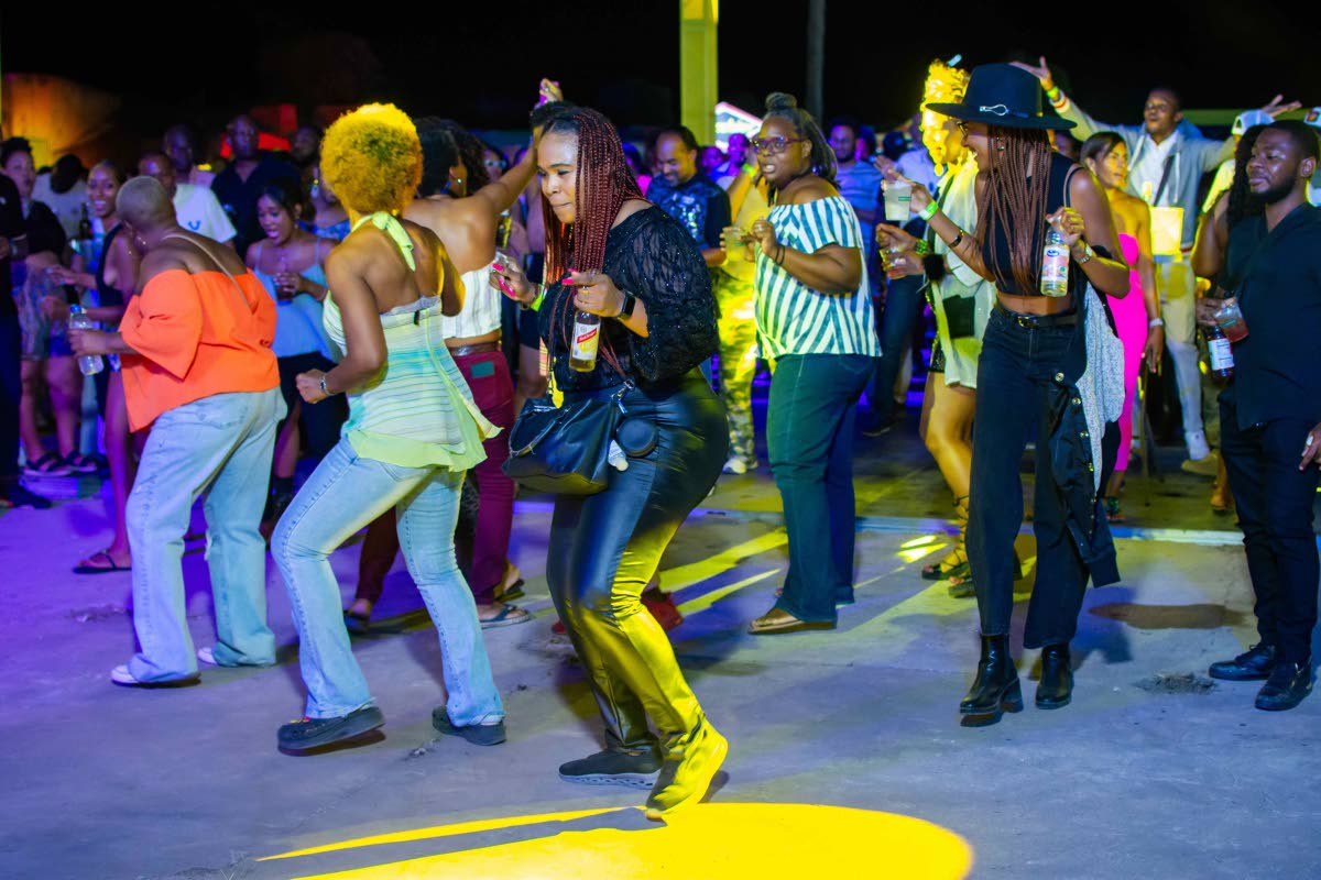 A group of patrons enjoying the infamous Cha Cha Slide by DJ Casper, at the Good Times retro party held at Fort Rocky, Port Royal, Kingston.