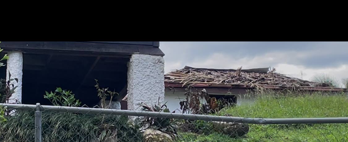 The slightly damaged roof of the house where National Hero, Sir Alexander Bustamante was born.