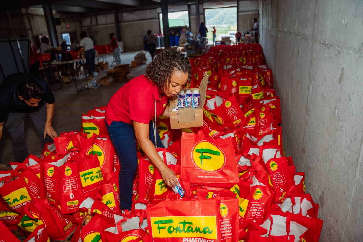 General manager, store operations, Dionne Smallhorn adding Tru Shake to the care package bags.
