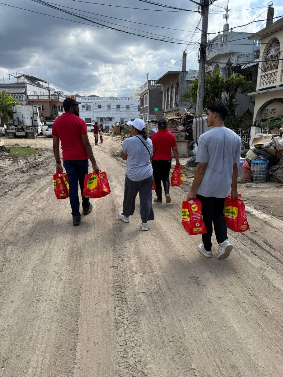 The Fontana team along with members of the community, on site handing out care packages to the residents of Bogue New Ramble Hill. From left: IT Manager, Valentine Ellis; CEO, Anne Chang; Fairview Store Manager, Leonie Harvey; Special Projects Manager, Jac