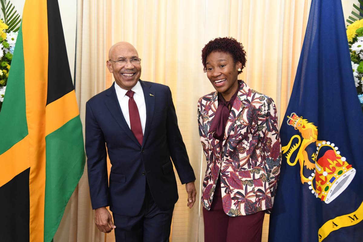 Patrick Allen, Governor General of Jamaica (left) shares a light moment with Tiana Dinham (right) after she was named the 2026 Rhodes Scholar on November 13, 2025 at King’s House.