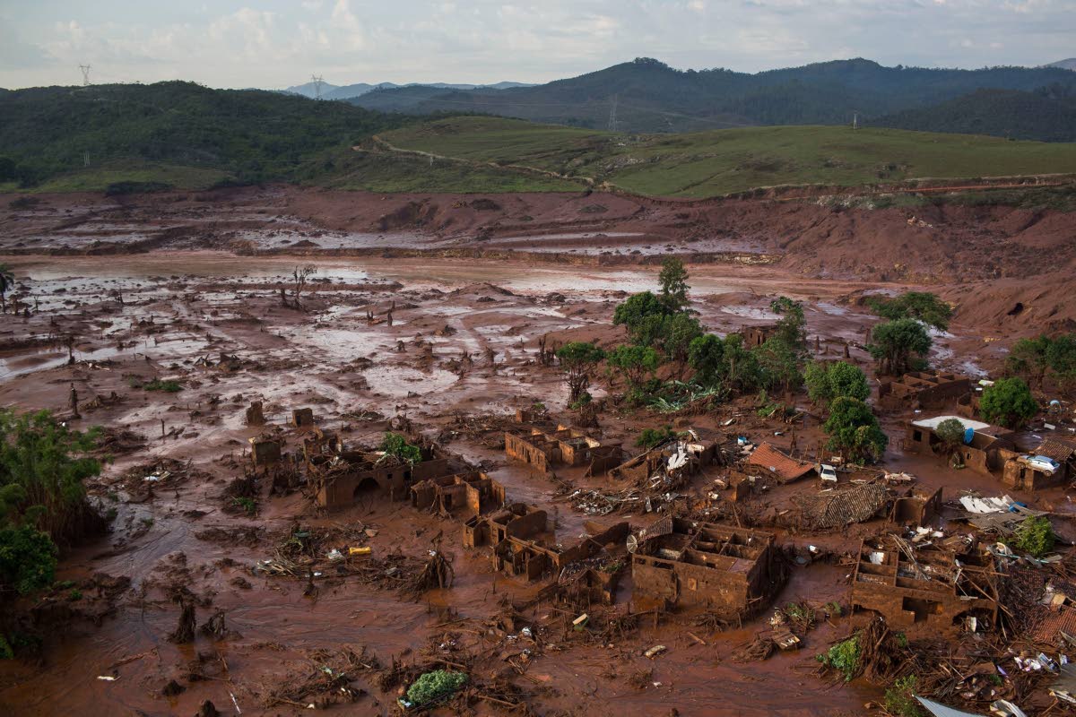 Debris is visible after a dam burst at the small town of Bento Rodrigues in Minas Gerais state, Brazil, in this November 6, 2015 photo.