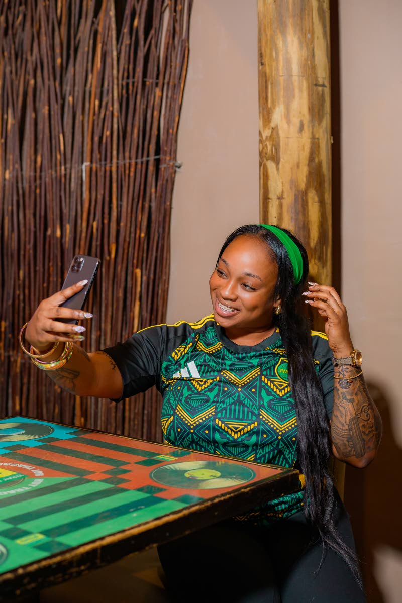 Businesswoman Iesha Bailey breaks from the festivities to snap a selfie.