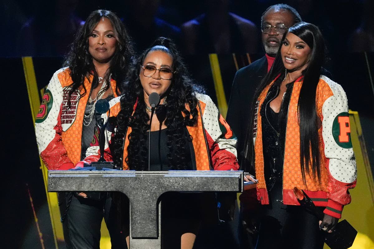 Cheryl ‘Salt’ James (second left) delivers the acceptance speech with Deidra ‘Spinderella’ Roper (left) and Sandra ‘Pepa’ Denton (right) after Salt-N-Pepa was inducted into the Rock and Roll Hall of Fame, while manager and producer, Hurby Azor,