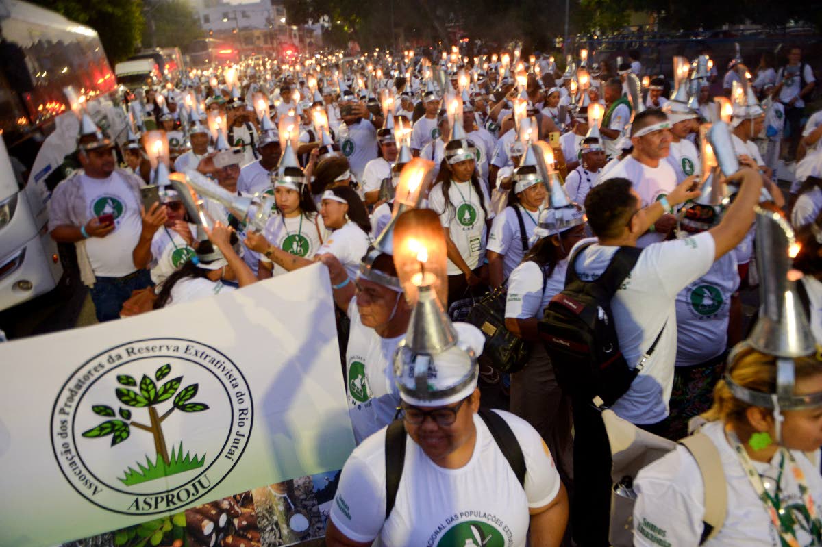 Activists during the ‘Porongaço’ march of the Forest Peoples. The name ‘Porongaço’ comes from the poronga, the oil lamp used by rubber tappers during their night work in the forest.